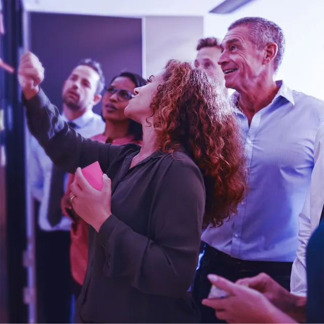 Banking professionals reviewing payment processing infrastructure and digital operations