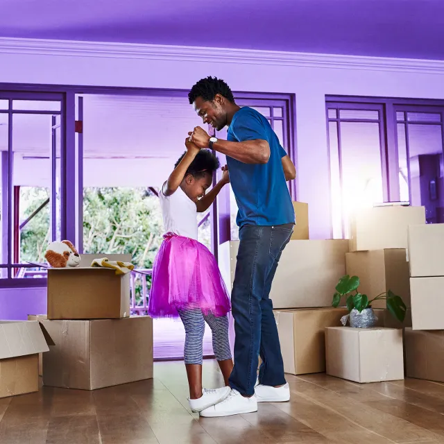 Family celebrating homeownership through a seamless mortgage lending experience