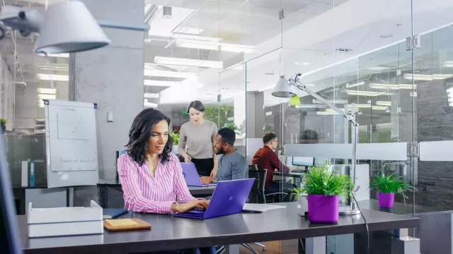 Woman with laptop in office