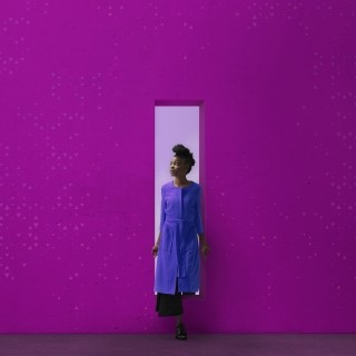 Woman stepping out of doorway