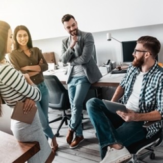 People conversing in an office