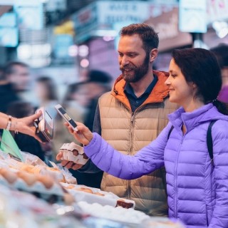 Couple buying food at stand