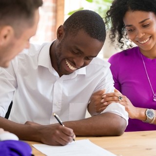 Man and woman signing