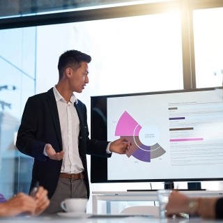 Image of man presenting chart in office meeting