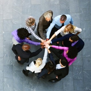 People huddled together as a team