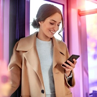 Image of woman on phone smiling