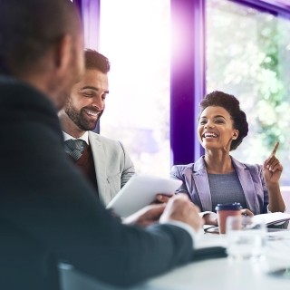 Image of team discussing in an office