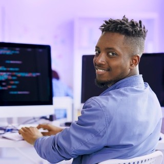 Image of man working on a computer