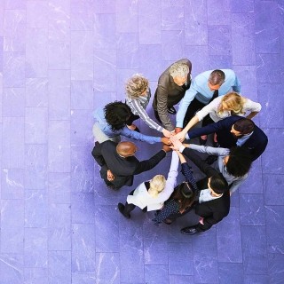 Image of team doing a hand-stack
