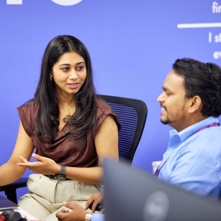Image of woman talking to officemate