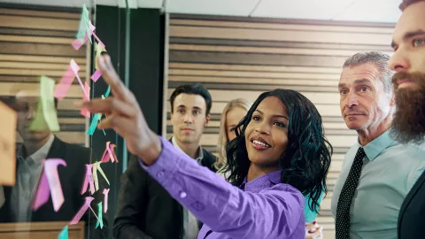 Woman pointing at post-it