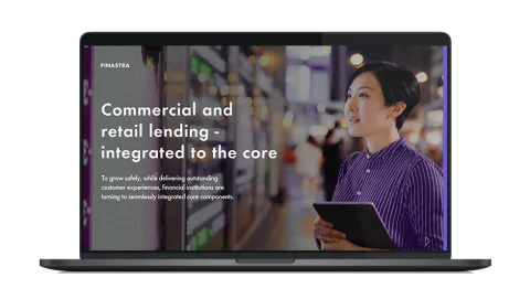 Image of laptop with cover slide for "Commercial and retail lending - integrated to the core" white paper
