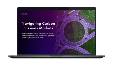 Image of laptop with cover slide for "Navigating carbon emissions markets" white paper