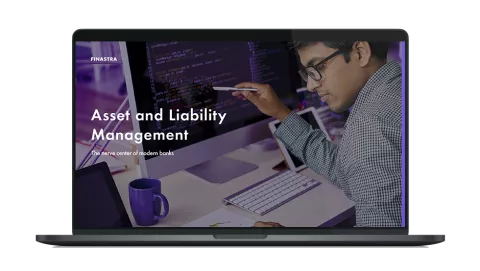 Image of laptop with cover slide for "Asset and liability management" white paper