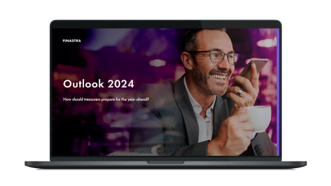Image of laptop with cover slide for "Outlook 2024: How should treasurers prepare for the year ahead?" white paper