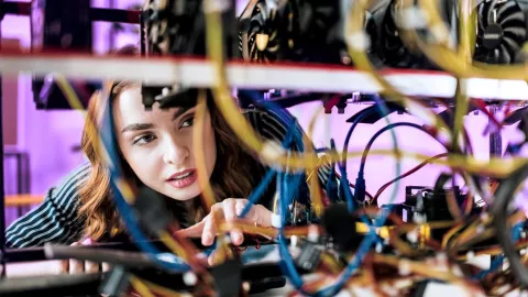 Image of woman checking wiring