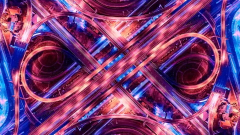 Image of complex highway crossroad at night