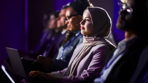 Image of audience people with laptops