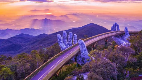 Image of a bridge supported by hand figures
