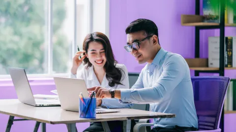 Banking professionals exploring AI-assisted services