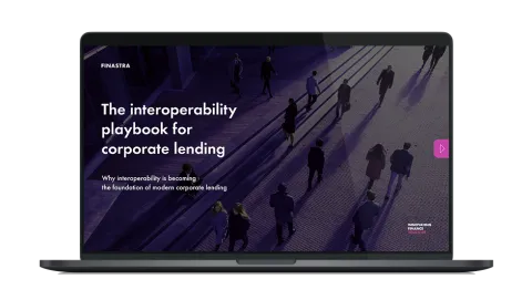 Image of laptop with cover slide of "The interoperability playbook for corporate lending" white paper