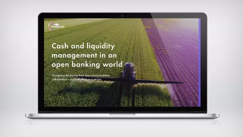 Image of Laptop with machine watering crops