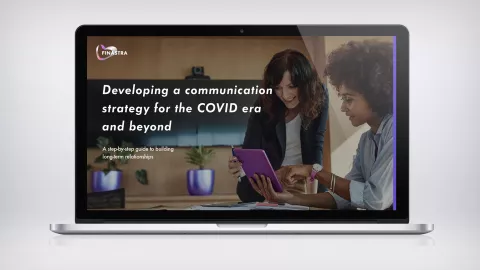Image of laptop with two women and a tablet