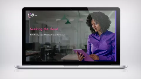 Image of laptop with woman and tablet