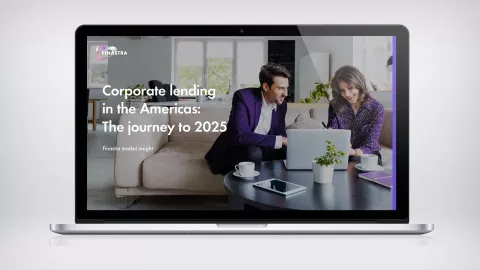 Image of laptop with two people looking at laptop