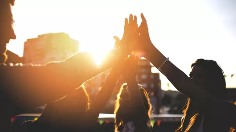 Image of group high-five