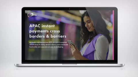Image of laptop with woman on phone