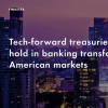 Image of laptop with cover slide for "Tech-forward treasuries take hold in banking transforming American markets" white paper